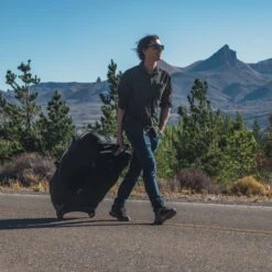 Osprey Sojourn Shuttle Wheeled Duffle/Suitcase -Outdoor Essentials Shop F23 SojournShuttleWheeledDuffel130LBlack 10005397 MatthewTangeman Exp 4 23 25 37 4copy